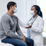 Man talking to physical medicine doctor