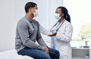 Man talking to physical medicine doctor