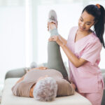 A Old Lady getting Physical therapy by Therapist