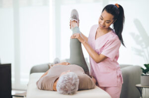A Old Lady getting Physical therapy by Therapist